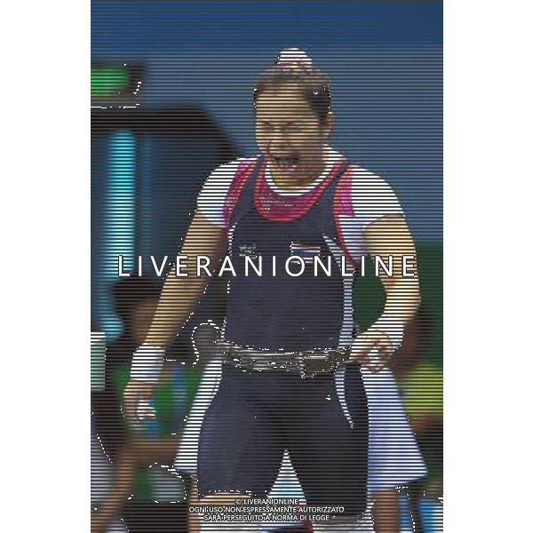 (110814) -- SHENZHEN, Aug. 14, 2011 () -- Pramsiri Bunphithak of Thailand celebrates during the women\'s 53KG weightlifting at the 26th Summer Universiade in Shenzhen, a city of south China\'s Guangdong Province, Aug. 14, 2011. Bunphithak got the bronze medal of the event with 205KG. (/Wang Song) (bxf)