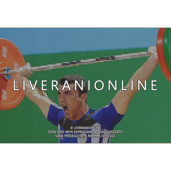 (110814) -- SHENZHEN, Aug. 14, 2011 () -- Gabriel olaru of Romania competes during the men\'s 56KG weightlifting at the 26th Summer Universiade in Shenzhen, a city of south China\'s Guangdong Province, Aug. 13, 2011. (/Wang Song) (bxf)