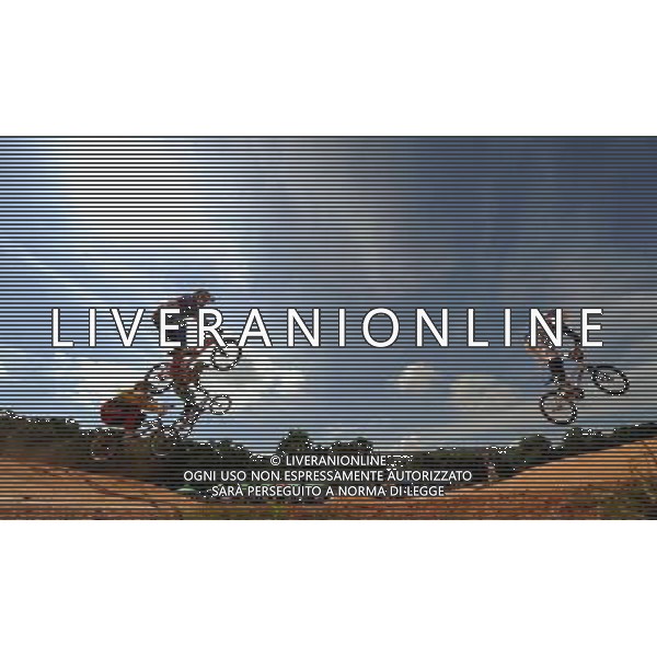 (110814) -- SHENZHEN, Aug. 14, 2011 () -- Kleshchenko Evgeniy (1st R) of Russia competes during the men\'s BMX individual race at the 26th Summer Universiade in Shenzhen, a city of south China\'s Guangdong Province, Aug. 14, 2011. Kleshchenko Evgeniy won the gold medal. (/Li Ga) (bxf)