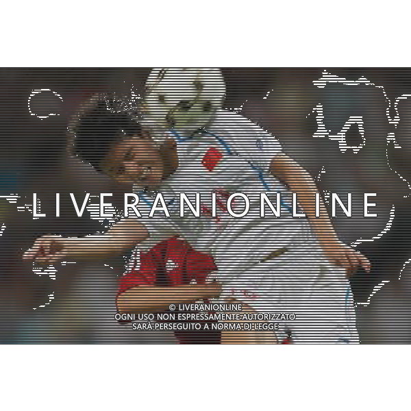 (110813) -- SHENZHEN, Aug. 13, 2011 () -- Wang Shanshan (front) of China heads the ball during the group A women\'s football match against Canada at the 26th Summer Universiade in Shenzhen, a city of south China\'s Guangdong Province, Aug. 13, 2011. China won 1-0. (/Liao Yujie)(lm)
