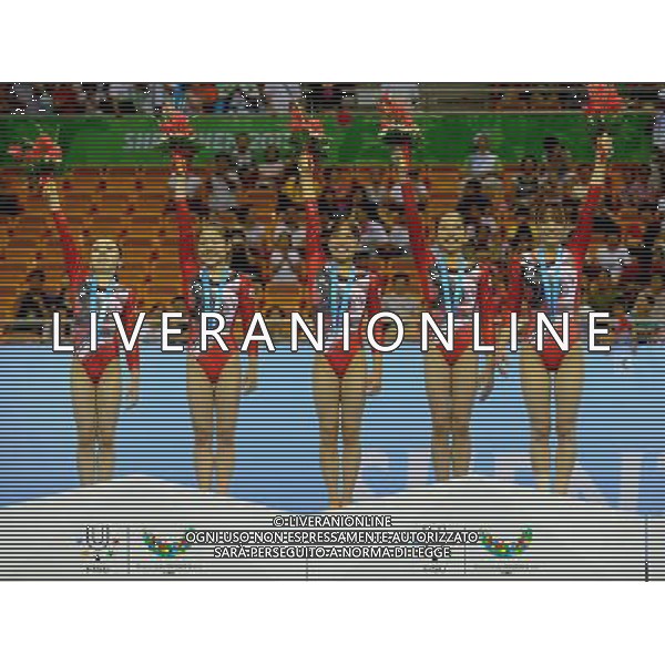 (110813) -- SHENZHEN, Aug. 13, 2011 () -- Team members of Japan pose on the podium at the awarding ceremony of women\'s team event of artistic gymnastics at the 26th Summer Universiade in Shenzhen, a city of south China\'s Guangdong Province, Aug. 13, 2011. Japan, Ukraine and Russia won the gold, silver and bronze medals respectively. (/Gong Lei)