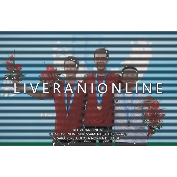 (110813) -- SHENZHEN, Aug. 13, 2011 () -- Bernhard Oberholzer (C) and Patrick Schelling (L) of Switzerland, and Genki Yamamoto of Japan pose during the awarding ceremony of men\'s 160km cycling road race at the 26th Summer Universiade in Shenzhen, a city of south China\'s Guangdong Province, Aug. 13, 2011. Bernhard Oberholzer claimed the champion with 3 hours 50 minutes and 22 seconds. Patrick Schelling and Genki Yamamoto took the 2nd and 3rd place. (/Li Ga)(lm)
