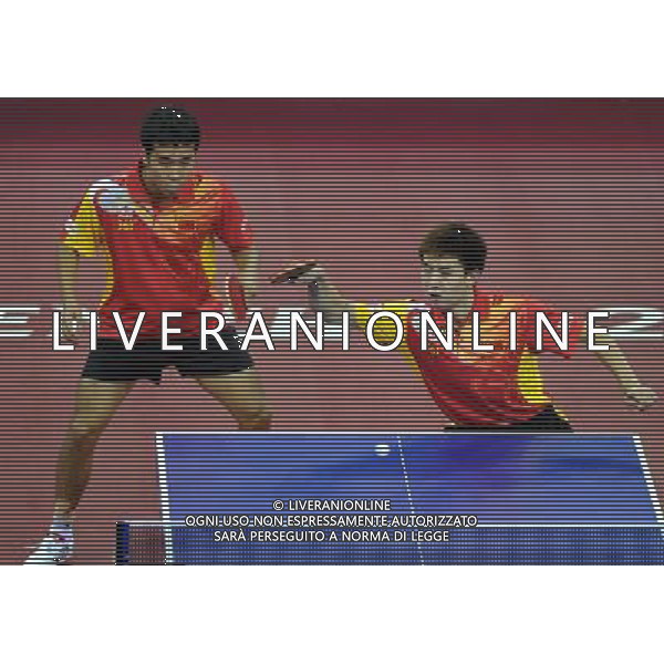 (110813) -- SHENZHEN, Aug. 13, 2011 () -- China\'s Shang Kun (L) and Fang Bo compete during the group A roundrobin of men\'s team table tennis against Yang Ling Kun and Pierre Luc Hinse of Canada at the 26th Summer Universiade in Shenzhen, a city of south China\'s Guangdong Province, Aug. 13, 2011. Shang Kun and Fang Bo won 3-0 and China won 3-0. (/Yang Shiyao)(lm)