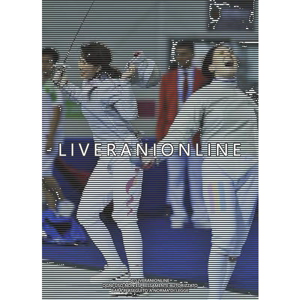 SHENZHEN, Aug. 15, 2011 Li Fei of China (L) and Pascu Alexandra of Romania react after their women\'s sabre individual quarterfinals at the 26th Summer Universiade in Shenzhen, a city of south China\'s Guangdong Province, Aug. 15, 2011. Pascu Alexandra won 15 11 to enter the semifinals. (/Wang Haofei)(bxf)