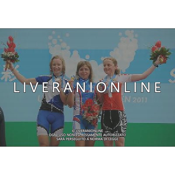 SHENZHEN, Aug. 15, 2011 Gold medalist Ksenia Kirillova of Russia (C), silver medalist Maaris Meier of Esthonia (L) and bronze medalist Melanie Gay of Switzerland celebrate during the awarding ceremony for women\'s MTB cross country race at the 26th Summer Universiade in Shenzhen, a city of south China\'s Guangdong Province, Aug. 15, 2011. Kirillova claimed the title of the event with 1 hour 12 minutes 24 seconds. (/Li Ga) (bxf)