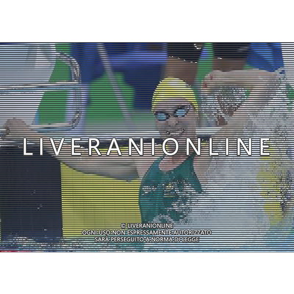 SHENZHEN, Aug. 14, 2011 Marieke Guehrer of Australia jubilates after winning the final of the women\'s 4x100m freestyle relay with her teammates at the 26th Summer Universiade in Shenzhen, a city of south China\'s Guangdong Province, Aug. 14, 2011. Australia claimed the title with 3:40.03 and set a new games record. (/Chen Jianli) (wll)