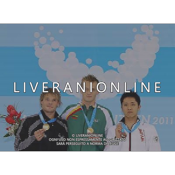 SHENZHEN, Aug. 14, 2011 Gold medalists Giedrius Titenis (C) of Lithuania, Glenn Snyders (L) of New Zealand and bronze medalist Kazuki Otsuka of Japan show their medals during the awarding ceremony for the men\'s 200m breaststroke at the 26th Summer Universiade in Shenzhen, a city of south China\'s Guangdong Province, Aug. 14, 2011. Glenn Snyders and Giedrius Titenis won the gold with the same time of 2:10.85. (/Chen Jianli) (wll)