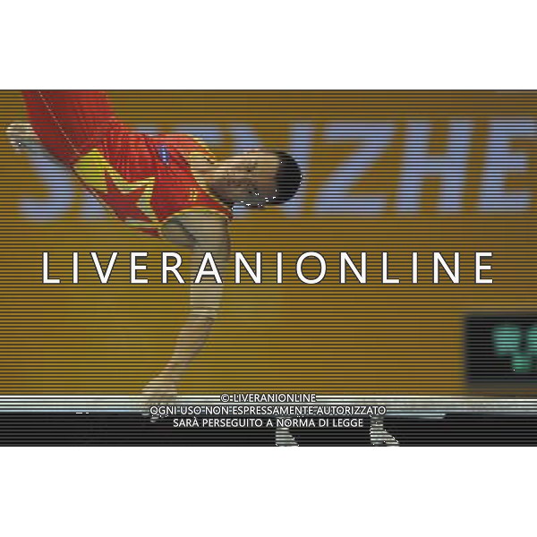 SHENZHEN, Aug. 14, 2011 Wang Guanyin of China competes in the parallel bars competition in the men\'s team competition of gymnastics at the 26th Summer Universiade in Shenzhen, a city of south China\'s Guangdong Province, Aug. 14, 2011. China took the sivler with 265.650 points in total. (/Gong Lei) (wll)