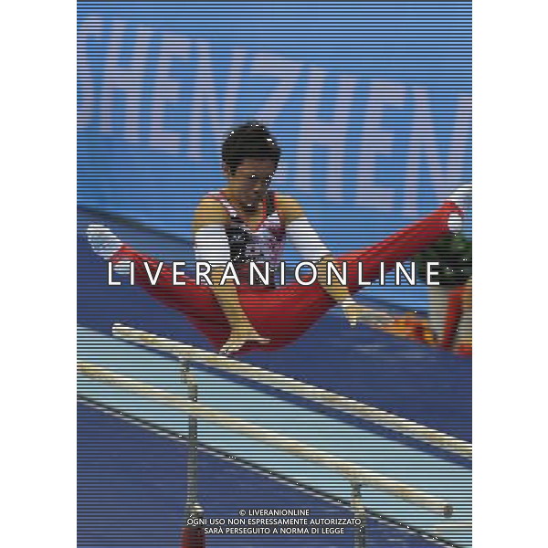 SHENZHEN, Aug. 14, 2011 Sejima Ryuzo of Japan competes in the competition of parallel bars of the men\'s team competition of gymnastics at the 26th Summer Universiade in Shenzhen, a city of south China\'s Guangdong Province, Aug. 14, 2011. Japan claimed the title with 269.200 points in total. (/Lin Yiguang) (wll)