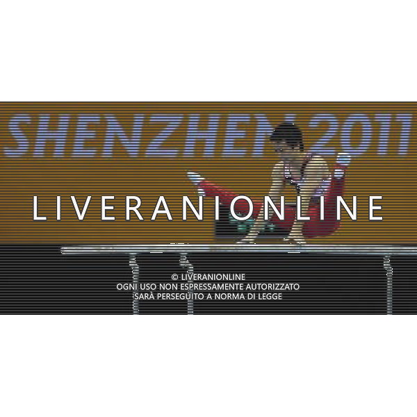SHENZHEN, Aug. 14, 2011 Shoichi Yamamoto of Japan competes in competition of the parallel bars of the men\'s team competition of gymnastics at the 26th Summer Universiade in Shenzhen, a city of south China\'s Guangdong Province, Aug. 14, 2011. Japan claimed the title with 269.200 points in total. (/Lin Yiguang) (wll)