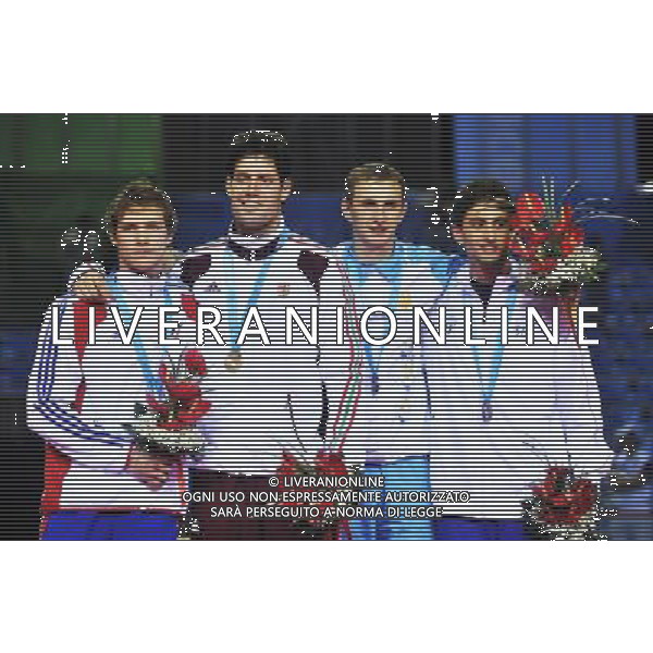 SHENZHEN, Aug. 14, 2011 Gold medalist Peter Szenyi (2nd L) of Hungary, silver medalist Virgile Marchal (1st L) of France, bronze medalists Anatoliy Herey of Ukraine (2nd R) and Raffaello Marzani of Italy pose for photo at the awarding ceremony of men\'s epee individual during the 26th Summer Universiade in Shenzhen, a city of south China\'s Guangdong Province, Aug. 14, 2011. (/Wang Haofei)