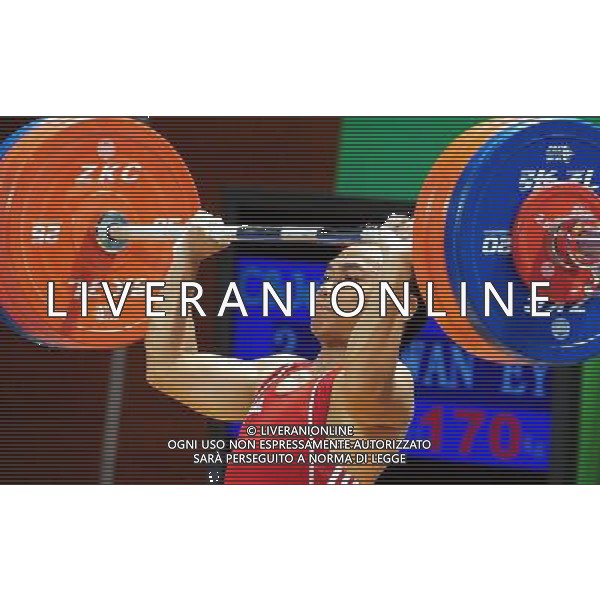 SHENZHEN, Aug. 14, 2011 Eko Yuli Irawan of Indonesia competes during the final of the men\'s 62kg of weightlifting at the 26th Summer Universiade in Shenzhen, a city of south China\'s Guangdong Province, Aug. 14, 2011. Eko Yuli Irawan claimed the title with 310kg in total. (/Wang Song) (wll)