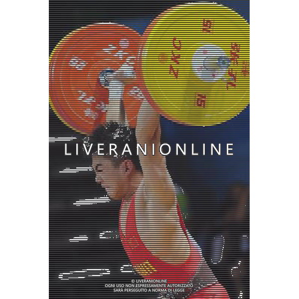 SHENZHEN, Aug. 14, 2011 Chen Meilong of China competes during the final of the men\'s 62kg of weightlifting at the 26th Summer Universiade in Shenzhen, a city of south China\'s Guangdong Province, Aug. 14, 2011. Chen took the silver with 285kg in total. (/Wang Song) (wll)