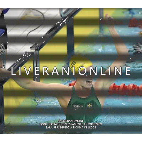 SHENZHEN, Aug. 14, 2011 Marieke Guehrer of Australia jubilates after winning the final of the women\'s 4x100m freestyle relay with her teammates at the 26th Summer Universiade in Shenzhen, a city of south China\'s Guangdong Province, Aug. 14, 2011. Australia claimed the title with 3:40.03 and set a new games record. (/Yang Shiyao) (wll)