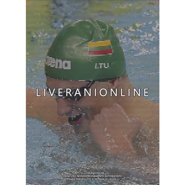 SHENZHEN, Aug. 14, 2011 Giedrius Titenis of Lithuania celebrates after the final of the men\'s 200m breaststroke at the 26th Summer Universiade in Shenzhen, a city of south China\'s Guangdong Province, Aug. 14, 2011. Giedrius Titenis and Glenn Snyders of New Zealand won the gold with the same time of 2:10.85. (/Liang Xu) (wll)