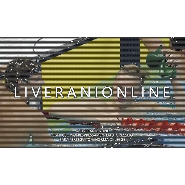 SHENZHEN, Aug. 14, 2011 Glenn Snyders(L) of New Zealand and Giedrius Titenis of Lithuania react after the final of the men\'s 200m breaststroke at the 26th Summer Universiade in Shenzhen, a city of south China\'s Guangdong Province, Aug. 14, 2011. Glenn Snyders and Giedrius Titenis won the gold with the same time of 2:10.85. (/Liang Xu) (wll)