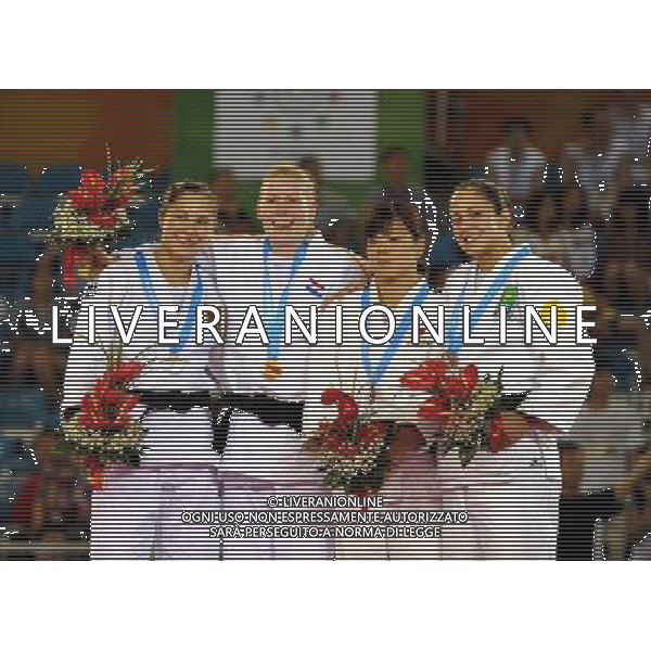 SHENZHEN, Aug. 14, 2011 Gold medalist Kim Polling (2nd L) of the Netherlands, silver medalist Laura Vargas Koch (1st L) of Germany, bronze medalists Yuko Imai(2nd R) of Japan and Natalia Bordignon of Brazil take a photo during the awarding ceremony for the women\'s 70kg of judo in the 26th Summer Universiade at Conference and Exhibiton Center (Hall 8) in Shenzhen, a city of south China\'s Guangdong Province, Aug. 14, 2011. (/Liu Dawei) (wll)