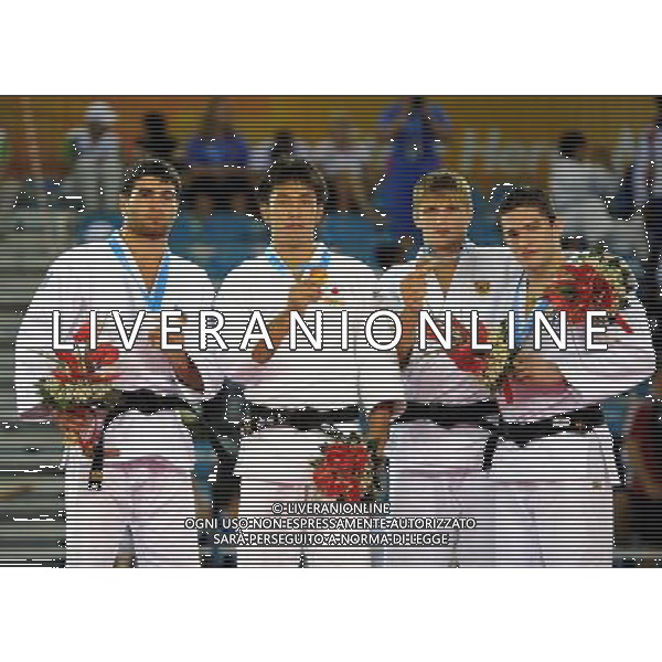 SHENZHEN, Aug. 14, 2011 Gold medalist Kawakami Tomohiro of Japan (2nd L), silver medalist Rustam Alimli of Azerbaijan (1st L), bronze medalists Murat Khabachirov of Russia (2nd R) and Victor Oliveira of Brazil pose on the podium during the awarding ceremony of men\'s Judo 81KG at the 26th Summer Universiade in Shenzhen, a city of south China\'s Guangdong Province, Aug. 14, 2011. (/Liu Dawei)