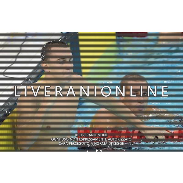 SHENZHEN, Aug. 14, 2011 Laszlo Cseh(L) of Hungary celebrates after winning the final of the men\'s 200m butterfly at the 26th Summer Universiade in Shenzhen, a city of south China\'s Guangdong Province, Aug. 14, 2011. Laszlo Cseh claimed the title with 1 minute and 55.87 seconds. (/Yang Shiyao) (wll)