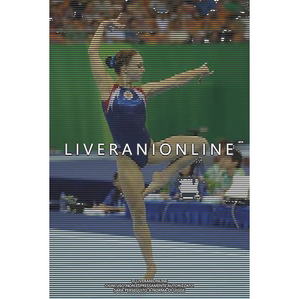 SHENZHEN, Aug. 15, 2011 Alena Polyan of Russia performs during the floor competion in women\'s individual all round final of artistic gymnastics at the 26th Summer Universiade in Shenzhen, a city of south China\'s Guangdong Province, Aug. 15, 2011. Alena Polyan took the bronze medal with a total of 55.350 points. (/Lin Yiguang)(kh)