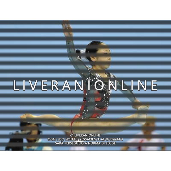SHENZHEN, Aug. 15, 2011 Minobe Yu of Japan competes during floor competion in women\'s individual all round final of artistic gymnastics at the 26th Summer Universiade in Shenzhen, a city of south China\'s Guangdong Province, Aug. 15, 2011. Minobe Yu took the silver medal with a total of 56.100 points. (/Lin Yiguang)(kh)
