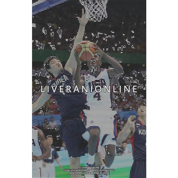 SHENZHEN, Aug. 15, 2011 Ashton Gibbs (C) of the United States goes up for a shooting during the men\'s preliminary round group D game of basketball against South Korea at the 26th Summer Universiade in Shenzhen, a city of south China\'s Guangdong Province, Aug. 15, 2011. The U.S. won 112 68. (/Meng Yongmin) (kh)
