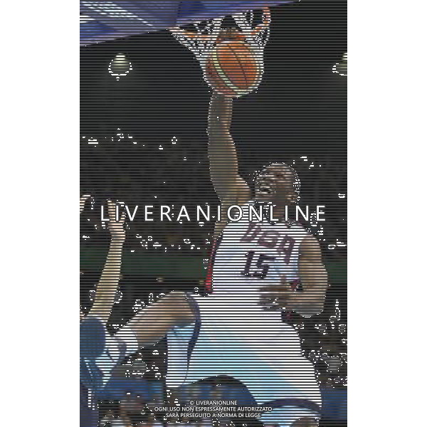 SHENZHEN, Aug. 15, 2011 Trevor Mbakwe (R) of the United States slams a dunk during the men\'s preliminary round group D game of basketball against South Korea at the 26th Summer Universiade in Shenzhen, a city of south China\'s Guangdong Province, Aug. 15, 2011. The U.S. won 112 68. (/Meng Yongmin) (kh)