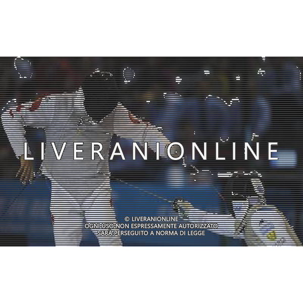 SHENZHEN, Aug. 15, 2011 Martino Minuto of Italy (R) and Lei Sheng of China compete during men\'s foil individual final at the 26th Summer Universiade in Shenzhen, a city of south China\'s Guangdong Province, Aug. 15, 2011. Martino Minuto won 15 13 to claim the title of the event. (/Guo Yong)(kh)