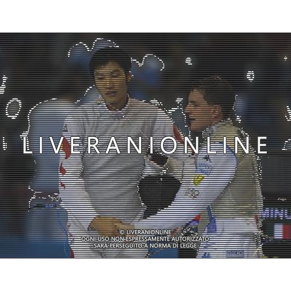 SHENZHEN, Aug. 15, 2011 Martino Minuto (R) of Italy shakes hands with Lei Sheng of China after men\'s foil individual final at the 26th Summer Universiade in Shenzhen, a city of south China\'s Guangdong Province, Aug. 15, 2011. Martino Minuto won 15 13 to claim the title of the event. (/Guo Yong)(kh)