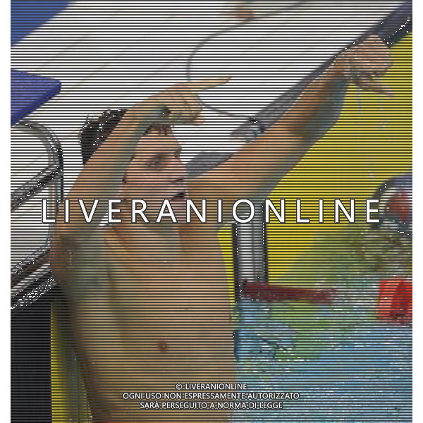 SHENZHEN, Aug. 15, 2011 Michael Klueh of the United States gestures after the men\'s 800m freestyle final of swimming at the 26th Summer Universiade in Shenzhen, a city of south China\'s Guangdong Province, Aug. 15, 2011. Michael Klueh claimed the gold of the event. (/Yang Shiyao)