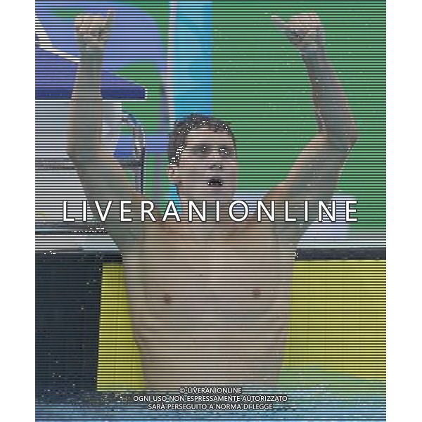 SHENZHEN, Aug. 15, 2011 Michael Klueh of the United States celebrates during the men\'s 800m freestyle final of swimming at the 26th Summer Universiade in Shenzhen, a city of south China\'s Guangdong Province, Aug. 15, 2011. Michael Klueh claimed the gold of the event. (/Chen Jianli)