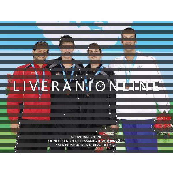 (110815) -- SHENZHEN, Aug. 15, 2011 () -- Gold medalist Gareth Kean of New Zealand (2nd L) of New Zealand, silver medalist Juan Miguel Rando Gavlvez of Spain (1st L), bronze medalists Kurt Peter Bassett (2nd R) of New Zealand and Sebastiano Ranfagni of France pose for group pictures during the awarding ceremony for men\'s 100m backstroke of swimming at the 26th Summer Universiade in Shenzhen, a city of south China\'s Guangdong Province, Aug. 15, 2011. (/Chen Jianli)