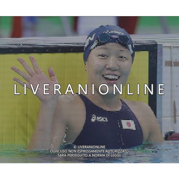 (110815) -- SHENZHEN, Aug. 15, 2011 () -- Izumi Kato of Japan gestures after the women\'s 200m individual medley final of swimming at the 26th Summer Universiade in Shenzhen, a city of south China\'s Guangdong Province, Aug. 15, 2011. Izumi Kato claimed the gold of the event with a time of 2:13.52. (/Chen Jianli)