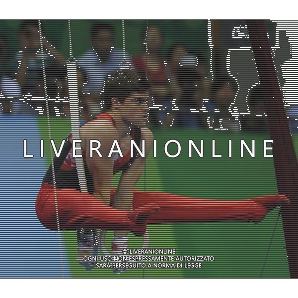 (110815) -- SHENZHEN, Aug. 15, 2011 () -- Nathan Gafuik of Canada performs during the rings competion in men\'s individual all-round final of artistic gymnastics at the 26th Summer Universiade in Shenzhen, a city of south China\'s Guangdong Province, Aug. 15, 2011. Nathan Gafuik won the bronze medal of the event. (/Lin Yiguang)(kh)