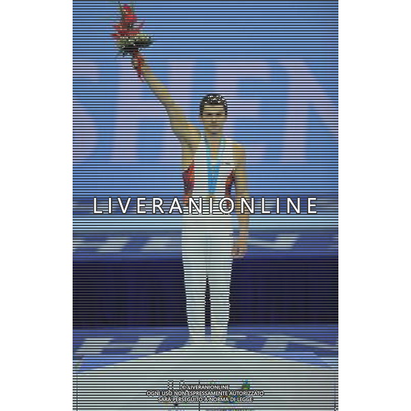 (110815) -- SHENZHEN, Aug. 15, 2011 () -- Mykola Kuksenkov of Ukraine reacts during the awarding ceremony for men\'s individual all-round of artistic gymnastics at the 26th Summer Universiade in Shenzhen, a city of south China\'s Guangdong Province, Aug. 15, 2011. Kuksenkov won with a total of 89.050 points. (/Gong Lei)(kh)