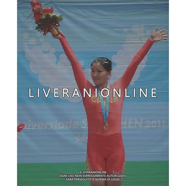 (110816) -- SHENZHEN, Aug. 16, 2011 () -- Gong Jinjie of China reacts during the awarding ceremony for women\'s 500m time trial of cycling track at the 26th Summer Universiade in Shenzhen, a city of south China\'s Guangdong Province, Aug. 16, 2011. Gong won the gold medal with 34.910 seconds. (/Li Ga)