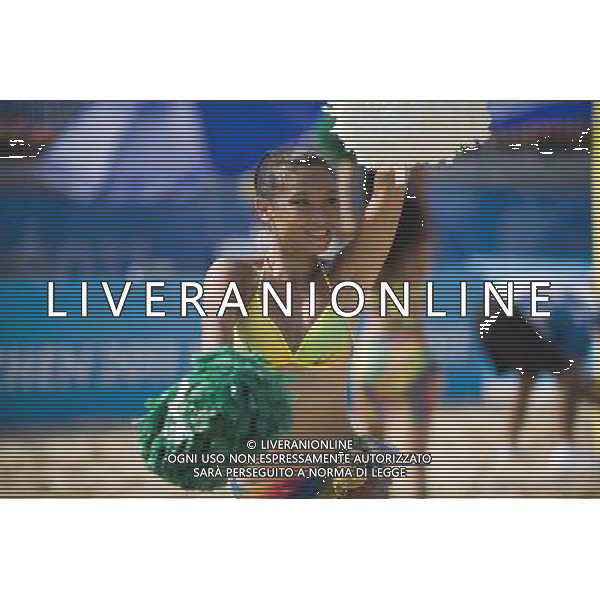 (110816) -- SHENZHEN, Aug. 16, 2011 () -- A bikini cheerleader performs at the Dameisha Seaside Park, venue of the beach volleyball event of the 26th Summer Universiade, in Shenzhen, a city of south China\'s Guangdong Province, Aug. 15, 2011. (/Lui Siu Wai)(lm)