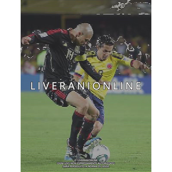 (110814) -- CARTAGENA, Aug. 14, 2011 () -- Colombia\'s Michael Ortega (R) vies for the ball with Jorge Henriquez (L) of Mexico during their quarterfinals at the U-20 World Championship in Cartagena, Colombia, on Aug. 13, 2011. (/Str) (rc)