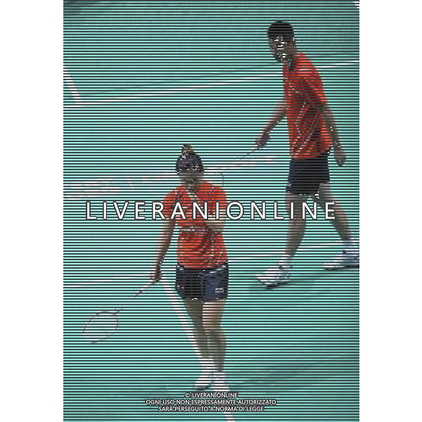 (110813) -- LONDON, Aug. 13, 2011 () -- China\'s Ma Jin (L) and Xu Chen react during their semifinal of mixed doubles against teammates Zhang Nan and Zhao Yunlei in 2011\'s Badminton World Championships at Wembley Arena, London, Britain, Aug. 13, 2011. Zhang and Zhao entered the final as Xu and Ma retired due to Ma\'s injury. (/Zeng Yi)(wll)