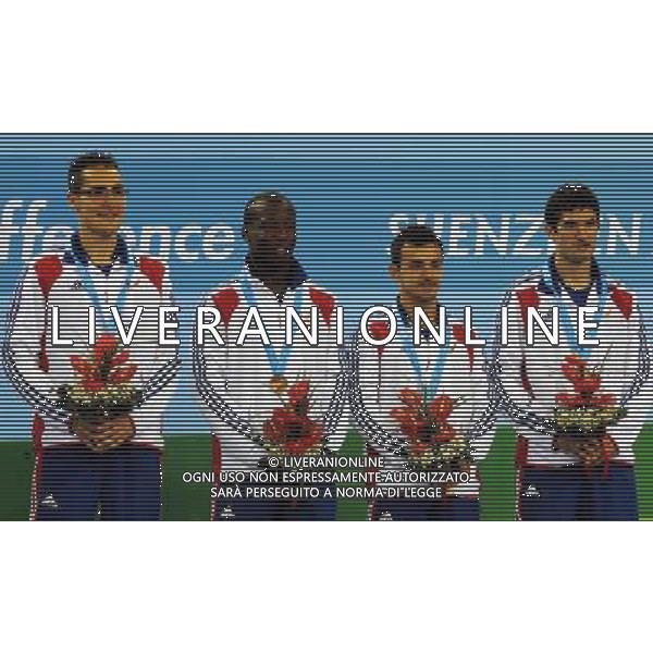 (110816) -- SHENZHEN, Aug. 16, 2011 () -- Team of France react during the award ceremony for the men\'s team of table tennis event at the 26th Summer Universiade, in Shenzhen, a city of south China\'s Guangdong Province, Aug. 16, 2011. France tied the bronze medal with Chinese Taipei. (/Yang Shiyao)(bxf)