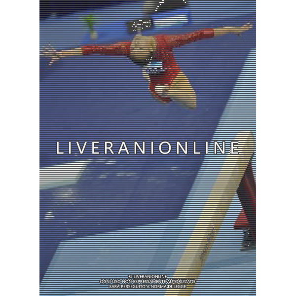 (110816) -- SHENZHEN, Aug. 16, 2011 () -- Guan Wenli of China competes during the women\'s balance beam final of artistic gymnastics event at the 26th Summer Universiade, in Shenzhen, a city of south China\'s Guangdong Province, Aug. 16, 2011. Guan won the silver medal with 14.000 points. (/Gong Lei)(bxf)