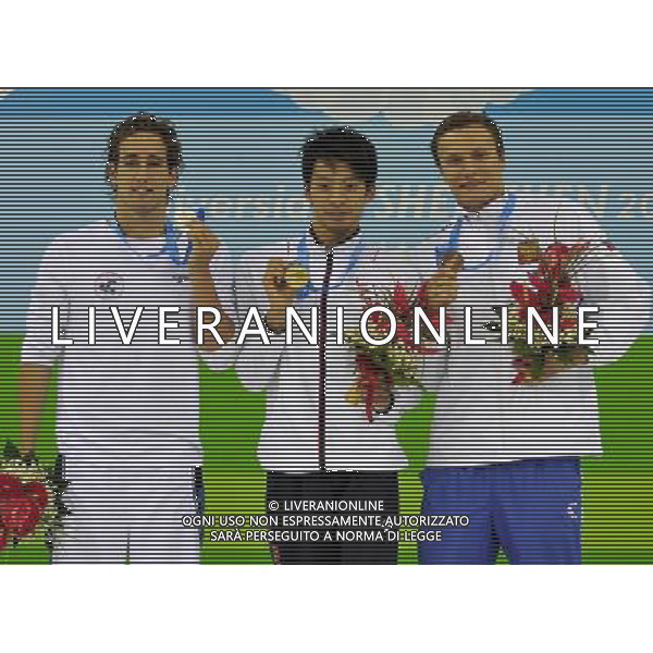 (110816) -- SHENZHEN, Aug. 16, 2011 () -- Gold medalist Ryosuke Irie of Japan (C), silver medalist Guy Barnea of Isreal (L), and bronze medalist Sergey Makov of Russia display their medals during the awarding ceremony of the men\'s 50m backstroke final of swimming at the 26th Summer Universiade in Shenzhen, a city of south China\'s Guangdong Province, Aug. 16, 2011. (/Liang Xu)