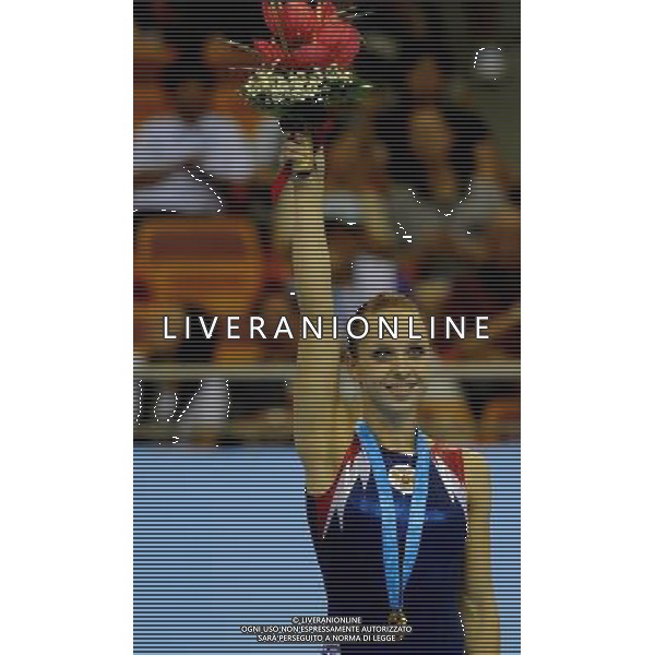 (110816) -- SHENZHEN, Aug. 16, 2011 () -- Alena Polyan of Russia celebrates during the awarding ceremony for the women\'s floor exercise final of artistic gymnastics event at the 26th Summer Universiade, in Shenzhen, a city of south China\'s Guangdong Province, Aug. 16, 2011. Polyan won the gold medal with 14.325 points. (/Lin Yiguang)(bxf)
