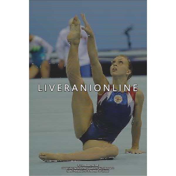 (110816) -- SHENZHEN, Aug. 16, 2011 () -- Alena Polyan of Russia performs during the women\'s floor exercise final of artistic gymnastics event at the 26th Summer Universiade, in Shenzhen, a city of south China\'s Guangdong Province, Aug. 16, 2011. Polyan won the gold medal with 14.325 points. (/Lin Yiguang)(bxf)