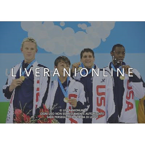 (110816) -- SHENZHEN, Aug. 16, 2011 () -- Swimmers of the team of the United States celebrates during the awarding ceremony of men\'s 4X200m freestyle relay of swimming at the 26th Summer Universiade in Shenzhen, a city of south China\'s Guangdong Province, Aug. 16, 2011. The team of the United States claimed the gold medal of the event with a time of 7:13.54. (/Chen Jianli)