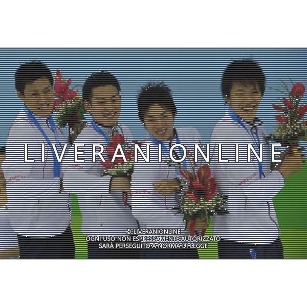 (110816) -- SHENZHEN, Aug. 16, 2011 () -- Swimmer of the team of Japan display their armbands showing support for the people in the tsunami-affected areas of Japan at the awarding ceremony of the men\'s 4X200m freestyle relay of swimming at the 26th Summer Universiade in Shenzhen, a city of south China\'s Guangdong Province, Aug. 16, 2011. The team of Japan won the silver medal of the event. (/Liang Xu)