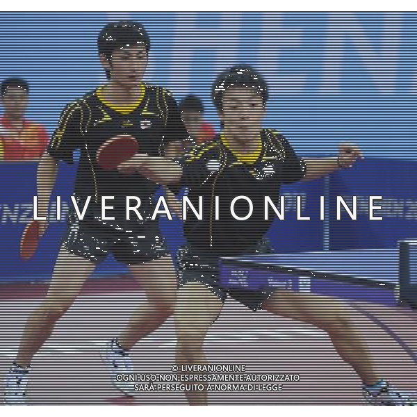 (110816) -- SHENZHEN, Aug. 16, 2011 () -- Japan\'s Kentaro Miuchi and Jin Ueda compete during the men\'s team final of table tennis event against China\'s Yan An and Fang Bo at the 26th Summer Universiade, in Shenzhen, a city of south China\'s Guangdong Province, Aug. 16, 2011. China won the gold medal of the event. (/Yang Shiyao)(bxf)