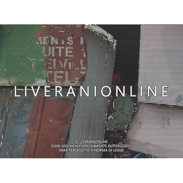 JOHANNESBURG, Aug. 16, 2011 A woman looks out from her home in a slum in Samampelo, Johannesburg, South Africa, Aug. 14, 2011. Over 15,000 people live in this slum, most of whom live on hard labour or small business. (/Li Qihua) (msq)