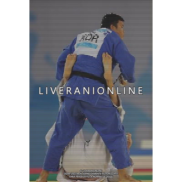 SHENZHEN, Aug. 16, 2011 Kim Sung Min of South Korea (blue) competes with Renat saidov of Russia during their men\'s Judo open final match at the 26th Summer Universiade in Shenzhen, a city of south China\'s Guangdong Province, Aug. 16, 2011. Kim Sung Min won the game and claimed the gold medal of the event. (/Liu Dawei)