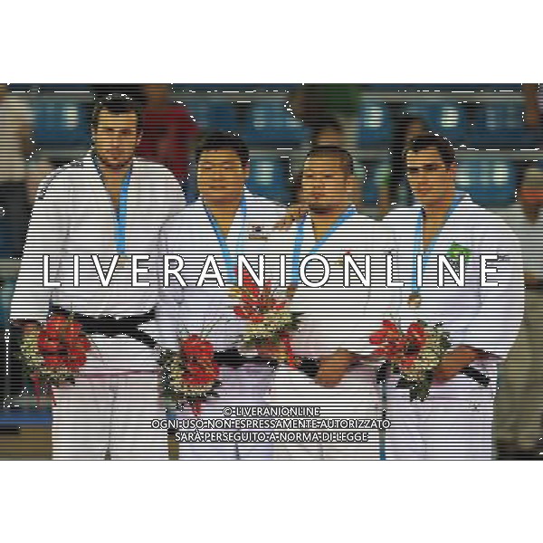 SHENZHEN, Aug. 16, 2011 Gold medalist Kim Sung Min (2nd L), silver medalist Renat Saidov of Russia (1st L) and bronze medalists Masaru Momose of Japan (2nd R) and David Silva of Brazil pose for group photos during the awarding ceremony of men\'s open Judo competition at the 26th Summer Universiade in Shenzhen, a city of south China\'s Guangdong Province, Aug. 16, 2011. (/Liu Dawei)